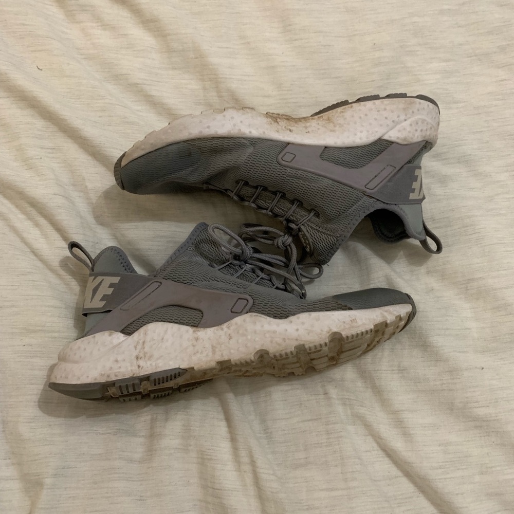 Gray and white Nike Huraches